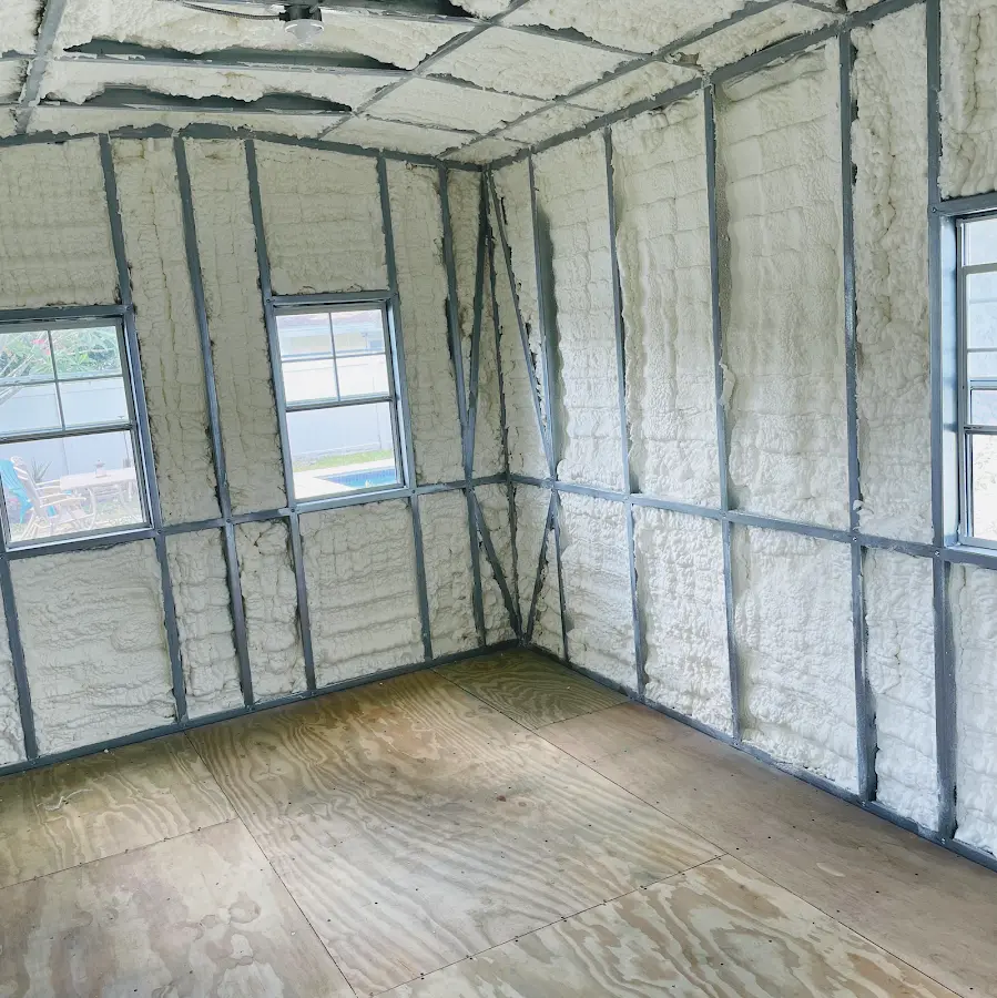 Closed-cell spray foam insulation applied to wall cavities in a residential project in Parkway